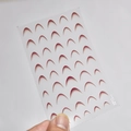 Macro shot of French gradient nail art stickers with smooth red to white transition - French Gradient - Wine Red (to5464)