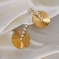Chic gold hoop earrings with sunburst texture and five inlaid pearls on silk background - Round Embossed / Gold Pearl Style