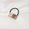 Detail of black elastic hair tie with textured gold metal accent on white silk fabric - Irregular Wrinkled (3) / Gold