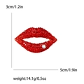 Red rhinestone lip brooch with gold metal base and clear crystal accent charm - Red