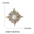 Vintage baroque sunburst brooch with large pearl and crystals on white background - Colorful