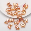 Macro detail of 10x14mm gradient orange butterfly glass beads for DIY jewelry making - Wine Red Plated