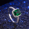 Classic silver ring with large square emerald gemstone and zircon accents on a blue background - US 6 / Green