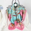 Turquoise and pink silk scarf with gold chain pattern tied on a white shirt - Lake Green Collar Chain