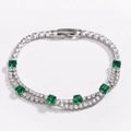 Detail view of double-layer tennis bracelet with square green gemstones and clear zircon - Green Square Zircon White Gold