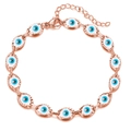 Detail of rose gold Evil Eye bracelet with lobster clasp and adjustable link chain - Rose Gold Cyan