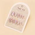 Detail view of iridescent laser nail tips on a white display card with aurora shine - By1722 / Glue Type