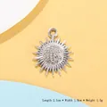 Silver sunburst snowflake pendant with crystals measuring 2.1cm by 1.8cm on colorful background - Silver Sunburst