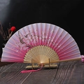 Chinese style folding fan with pink cherry blossoms, butterfly pattern and silk tassel - Cherry Blossom Butterfly