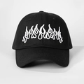 Close-up of white flame embroidery on black cotton baseball cap with six-panel design - Black with White Logo / One Size