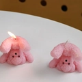 Pink poodle shaped creative scented candle in inverted pose for home decoration - Purple