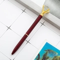Elegant wine red metal ballpoint pen featuring a large crystal diamond top and gold accents - Burgundy