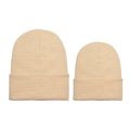 Detail of beige knitted beanies showing fine texture and roll-up cuff in two sizes - Off White