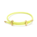 Neon yellow braided wire bracelet with adjustable gold-toned metal sliders on white background - Yellow