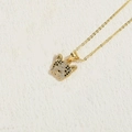 Golden necklace with leopard head pendant paved with white and black zircon crystals - Gold Cat Head