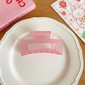 Matte pink translucent rectangular hair claw clip for thick hair displayed on a tray - Purple Pink