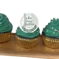 Detail view of silver acrylic disc topper with Merry Christmas engraving on green cupcake - Silver Christmas Style 4
