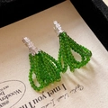 Elegant silver stud earrings featuring green beaded circular tassel and sparkling rhinestones - Silver-Green Tassel