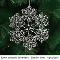 Close-up of 80mm acrylic windmill snowflake ornaments on a green Christmas tree - 80mm Windmill Snowflake