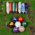 Detail shot of natural crystal healing set with 32mm pillars and 16mm spheres on green moss - 14Pcs Mixed Set (Spheres & Wands)