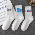 Three-pack white cotton athletic crew socks featuring colorful graffiti letter prints - Combo 5-6-8
