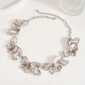 Detailed view of silver metallic ginkgo leaf necklace with textured petal elements - Necklace-Silver Flower