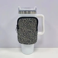 Leopard print neoprene pouch with zipper detail attached to a 40oz tumbler handle - No. 7 Leopard Print