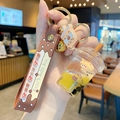 Brown bubble tea bear keychain featuring quicksand bottle and bear's milk tea strap - Bear Milk Tea - Cup with Lid