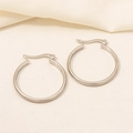 Detail of silver hoop earrings featuring horizontal textured lines and a secure latch clasp - D187-Silver Horizontal Stripe Large Hoop / Silver