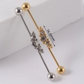 Industrial barbell piercing in silver and gold steel with CZ flower accents and 14.5mm bar - NO 6 Snowflake