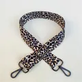Close-up of leopard print shoulder strap with adjustable gunmetal buckle and swivel hooks - Pattern 48 Gunmetal Clasp