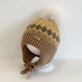 Kids knitted earflap hat with yellow and brown geometric patterns and white pom-pom - Rhombus Twist / Yellow Khaki
