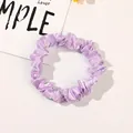 Detailed macro view of pink satin scrunchie with smooth silk-like texture and soft pleats - Satin Thin Scrunchie-Girlish Pink