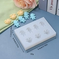 Detailed view of silicone mold featuring astronaut and deer motifs with dimensions - 3 Reindeer & 4 People Style