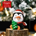 Christmas penguin figurine with red scarf and tree, resin holiday table decoration - Penguin SD05