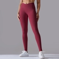 Detail of high-waist crisscross ribbed waistband on dark red seamless yoga leggings - S / Burgundy