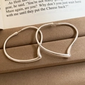 Macro shot of silver heart hoop earrings on a vintage book and velvet jewelry box - 12# Silver Large Heart Hoop Ear Cuff