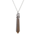 Detail of tiger eye hexagonal stone pendant with ornate silver metal cap on chain - Tiger's Eye