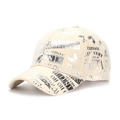 Close-up of beige Christmas baseball cap featuring silver Santa Claus lettering print - One Size / Off White