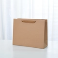 Durable brown kraft paper gift bag with matching woven rope handles for retail shopping - Large Horizontal Style