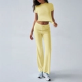 Women's casual two-piece lounge set in light yellow featuring short sleeve top and flare pants - S / Yellow