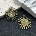 Pair of vintage bronze sun pendants with face design and antique finish for DIY jewelry - Sun 1459 Antique Bronze 30x34mm