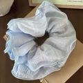 Light blue textured scrunchie with layered ruffle edges and checkered fabric detail - Multi-layer Pleated Texture / Blue