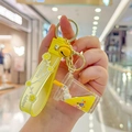 Yellow liquid shaker unicorn cup keychain with golden bell and Happy Moments strap - Yellow-Unicorn Milk Tea Cup