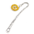 Macro detail of silver metal bookmark with yellow beads and sun star engravings - Silver + Topaz Color