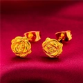 Polished gold-plated brass rose stud earrings displayed on elegant red silk fabric - Style 14 Rose Stud Earrings (1 Pair With Backs)