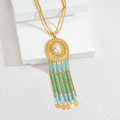 Collier à pompons bohème avec chaîne dorée, perle blanche et perles bleu-vert chic - Cyan