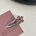 Pink rhinestone flower hair clip with silver metal base shown on a decorative card - Silver/Pink Zirconia-Small Flower