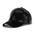 Detail view of black PU leather baseball cap with unique square embossed texture and glossy finish - Black
