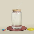 Transparent color-changing glass can with bamboo lid and straw on red base - Clear Cup With Lid and Straw